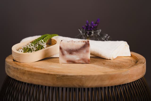 Nourish Vanilla Cream on wooden board with decorative elements