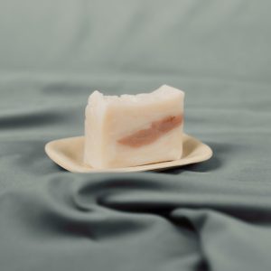 Nourish Fresh soap on wooden board with decorative elements