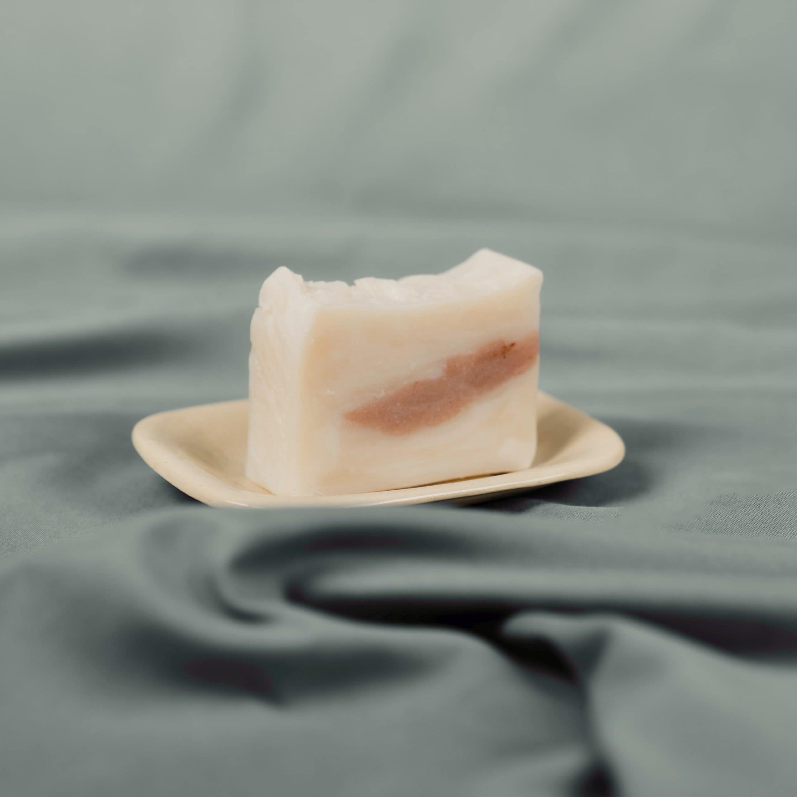 Nourish Fresh soap on wooden board with decorative elements