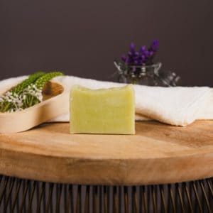 Nourish Fresh Soap on a wooden board with decorative elements