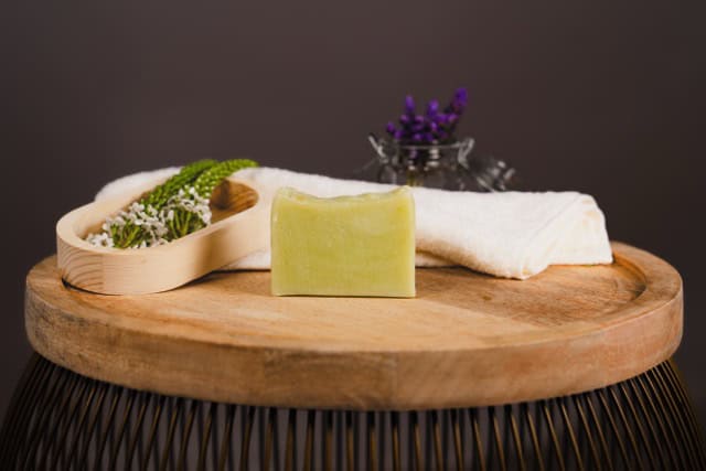 Nourish Fresh Soap on a wooden board with decorative elements