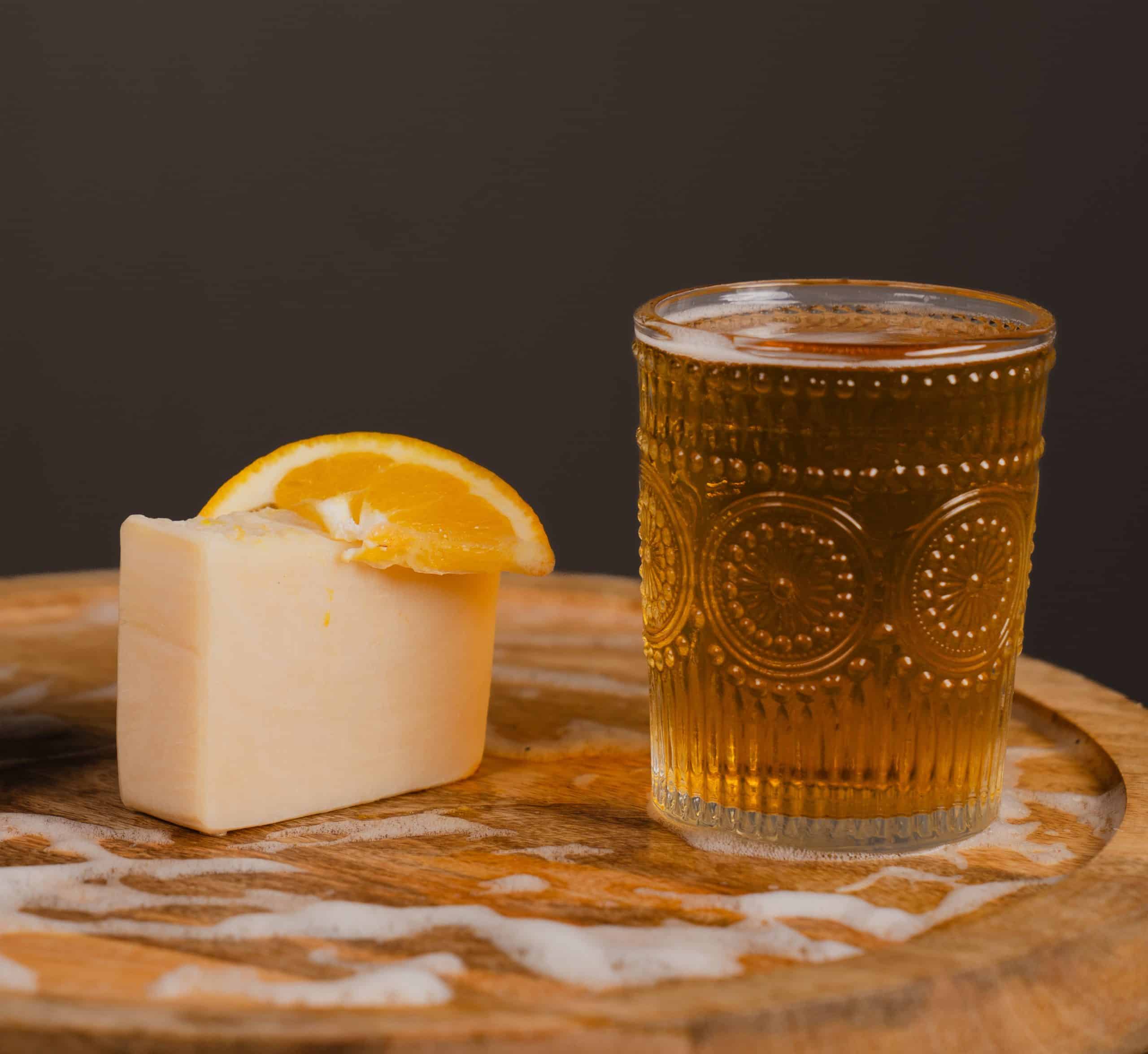 Handcrafted natural shampoo bar with honey and orange.